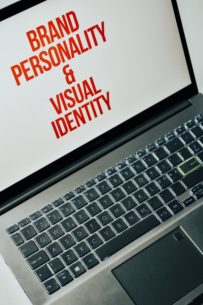 our-services-2 Laptop screen showing text on brand personality and visual identity for marketing strategy.